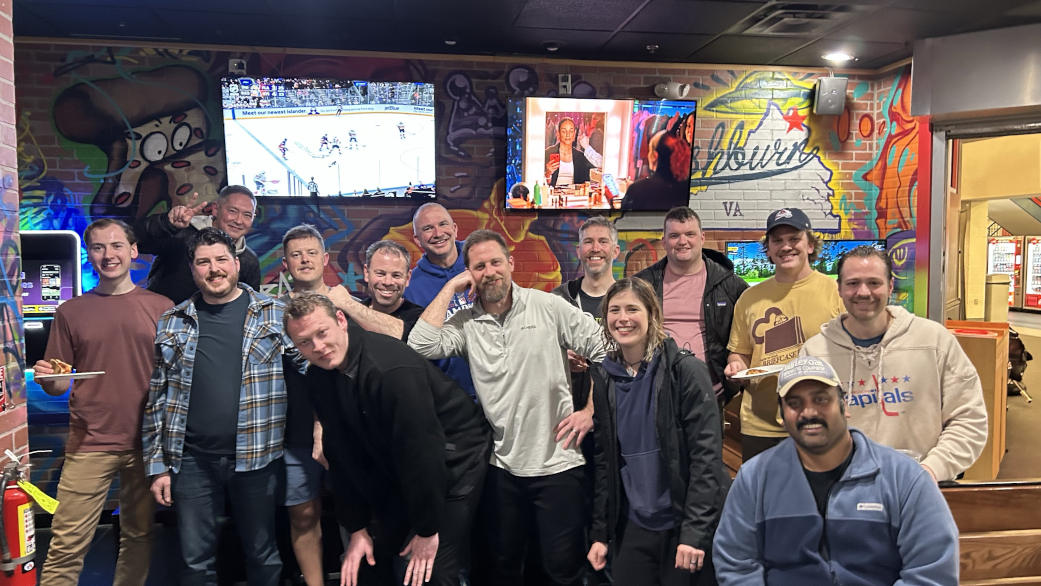 a team photo of OrrLoco hockey at the end of the 2025-2026 season, at the Slice Theory pizza place in Ashburn Ice House